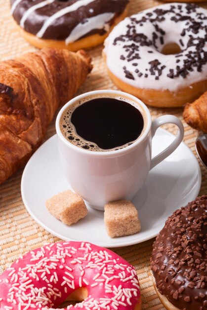 Breakfast with coffee donats and croissants