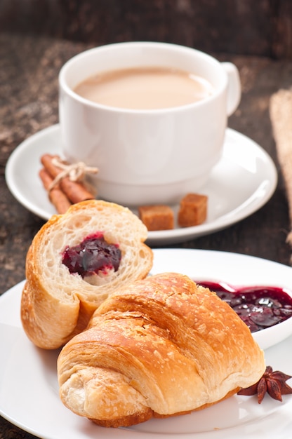 Breakfast with coffee and fresh croissants