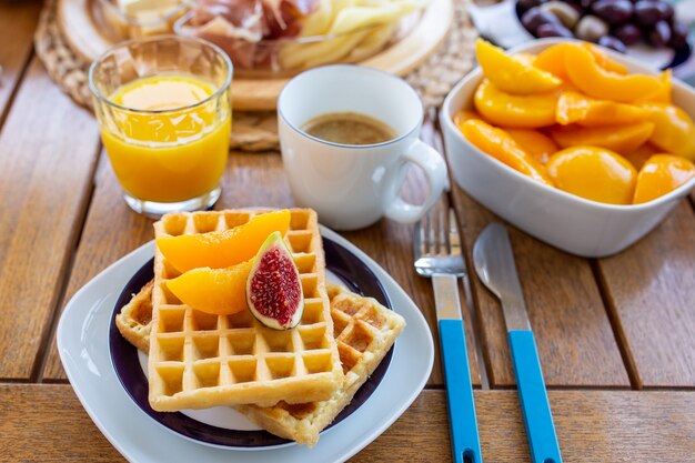 breakfast with coffeeWaffles for breakfast with jamWaffles for breakfast with jam and fruit