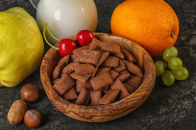 Breakfast with corn chokolate pads fruits and milk