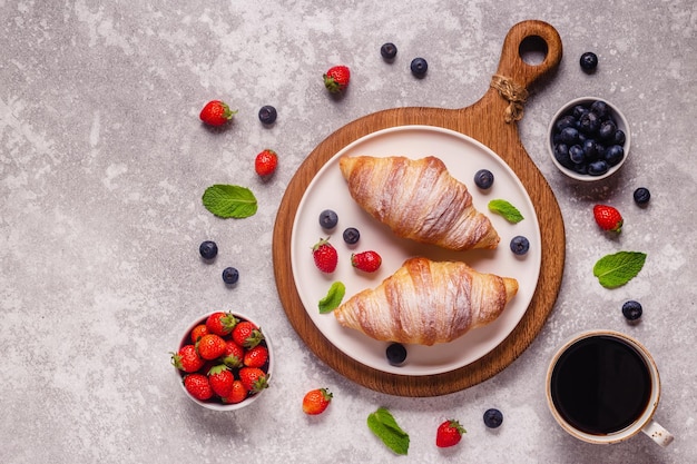 Breakfast with croissants and fresh fruits