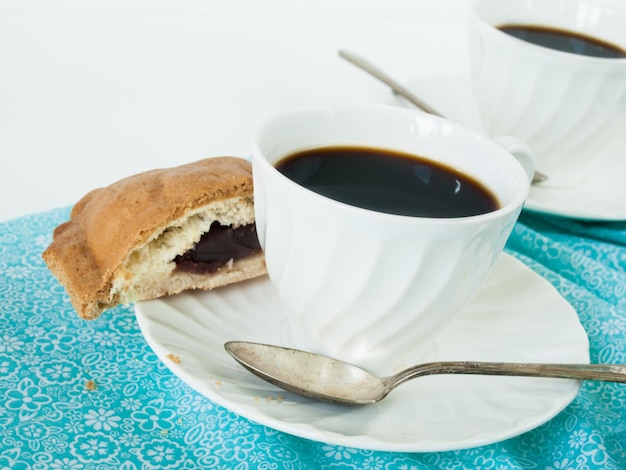 Breakfast with gourmet roti bun and coffee.