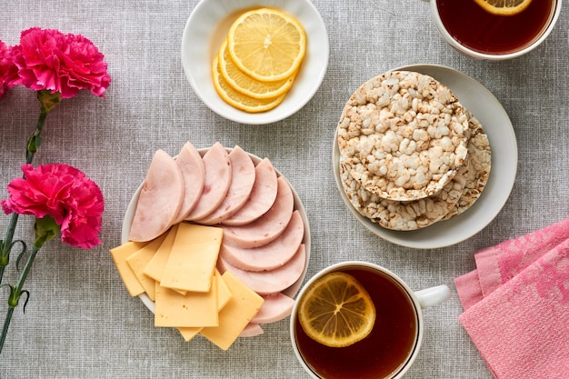 Breakfast with ham and cheese on gray fabric