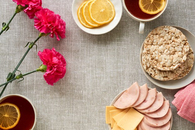 Breakfast with ham and cheese on gray fabric