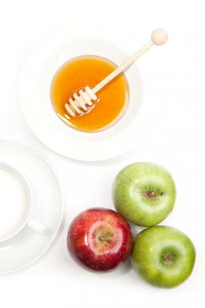 Foto colazione con latte, miele e mele