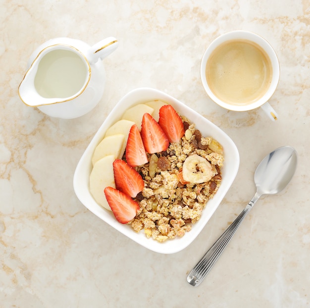 Breakfast with muesli, strawberry and banana