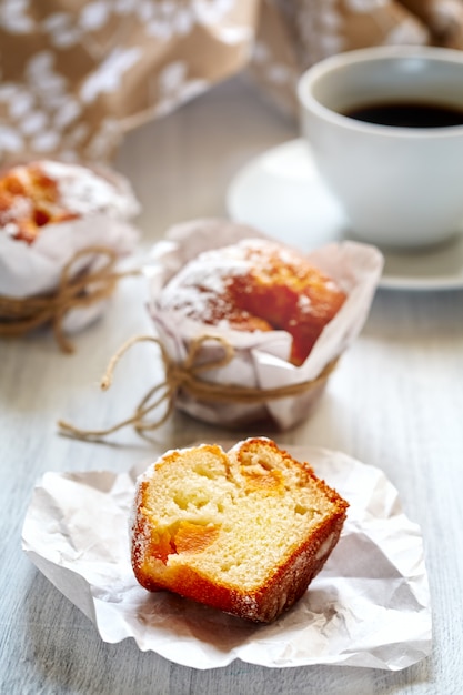 Breakfast with muffins and coffee close up