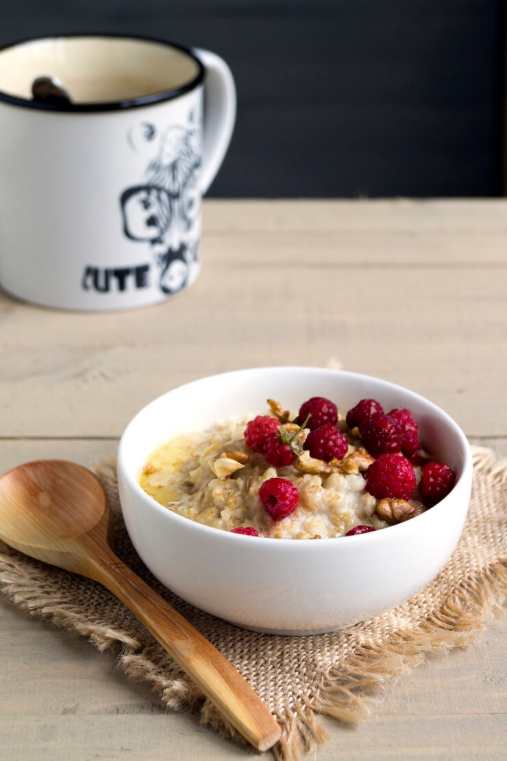 Breakfast with oatmeal and fresh raspberries.