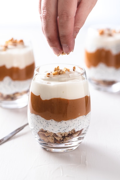 Breakfast of yogurt with chia, peanut cream and nuts