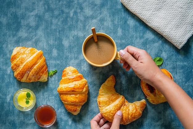 BreakfastContinental breakfast with fresh croissants orange juice and coffee selective focuse