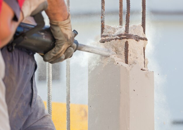 Breaking reinforced concrete with jackhammer