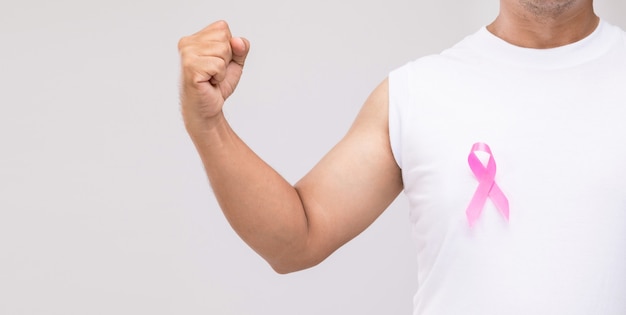 Breast cancer in men concept : Portrait Asian man and pink ribbon the symbol of breast cancer campaign. 