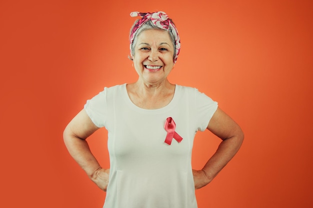 Breast Cancer Protection Symbol Mature Woman With Pink Ribbon on and White t shirt isolated for breast cancer campaign