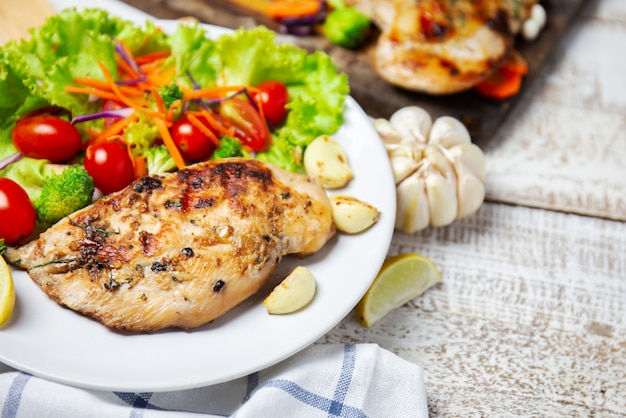 Breast chicken salad serve with fresh vegetables 