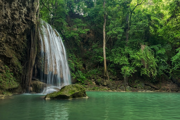 Breathtaking green waterfall at deep forest, Erawan waterfall located Kanchanaburi Provinc