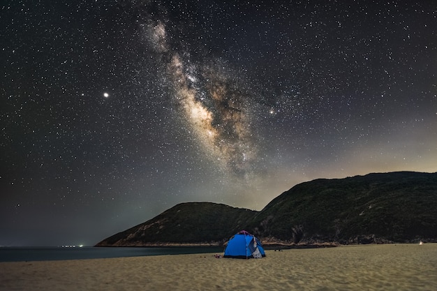 Breathtaking scenery of the Milky Way Galaxy in the scenic night sky over the seascape