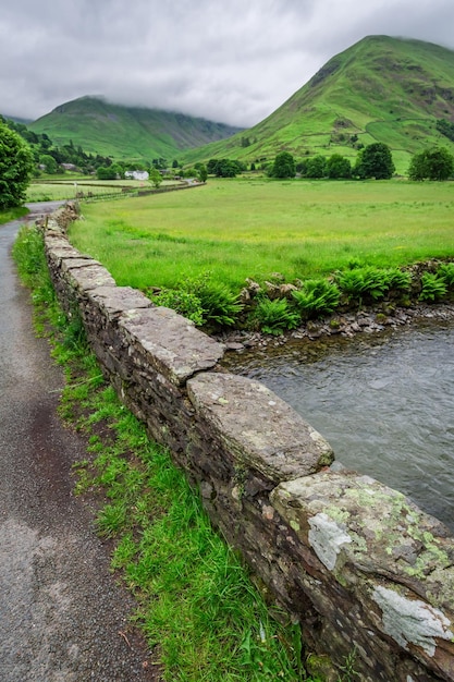 Breathtaking view to foggy and green District Lake England