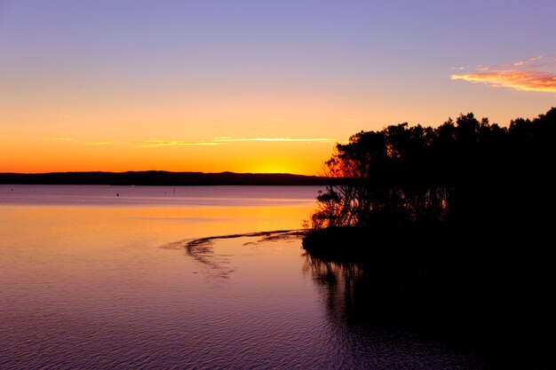 Breathtaking view of an island in the middle of a lake captured at sunset