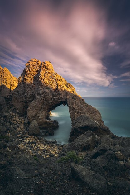 Breathtaking view of the seascape and rocks at the scenic dramatic sunset