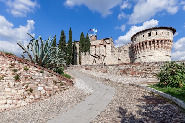 Brescia - Italy. April 25, 2021: Beautiful view at the entrance to the historic castle of Brescia on a sunny summer day. Lombardy, Italy