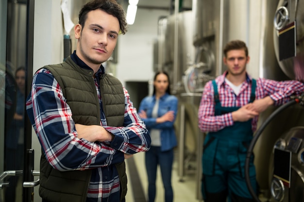 Brewers posing at brewery factory