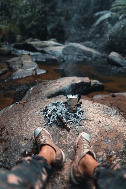 Brewing coffee in the forest with a moka pot