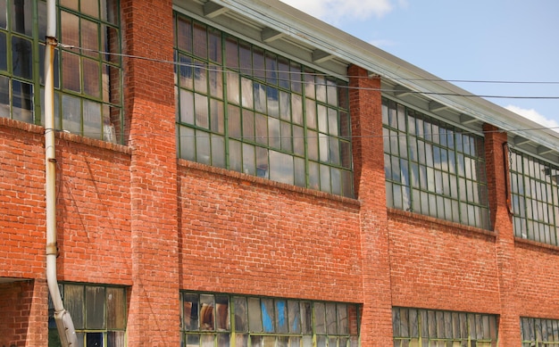 A brick building with a large window that says'the word art'on it