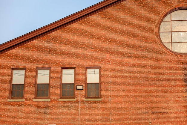 A brick building with a sign that says'the word " on it