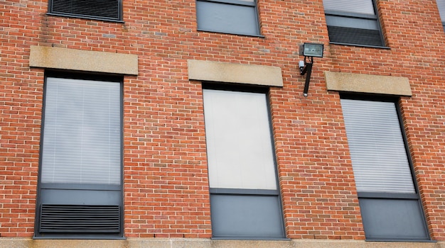 A brick building with a window that says'the window '