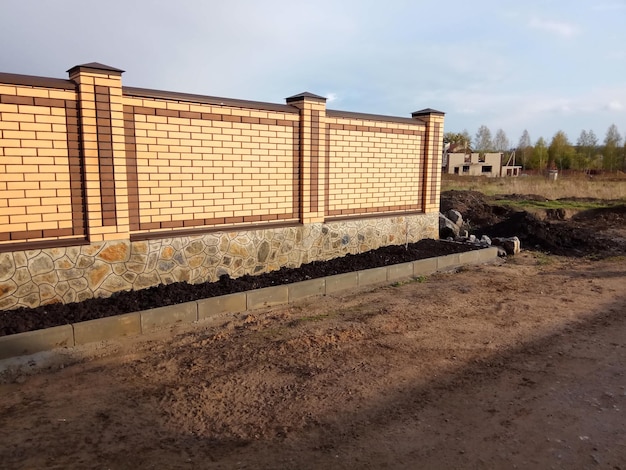 Brick fence on sunset