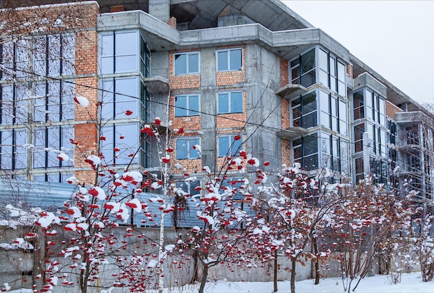 Brick house from a red brick, construction area construction of multi-storey residential buildings