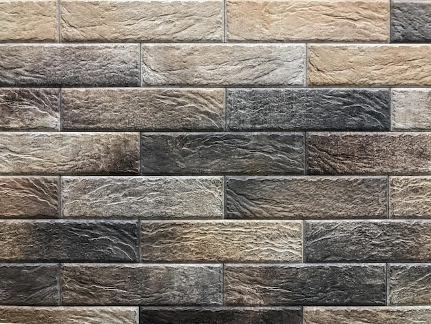Brick-like wall tiles of light color, gray, red. decorative tiles
