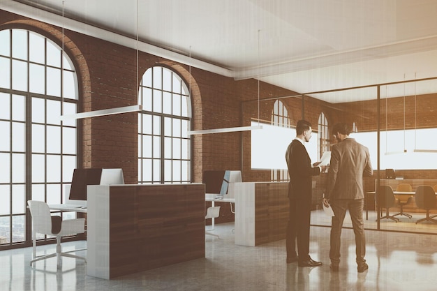 Brick open space office interior with arch windows, a concrete floor and cubicles. A side view. Businessmen. 3d rendering mock up toned image double exposure