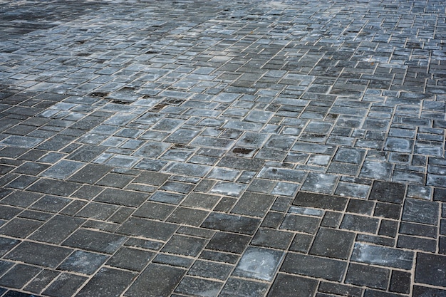 Brick path or sidewalk with perspective going into the distance with soft sunlight reflecting of the bricks Long paved brick footpath