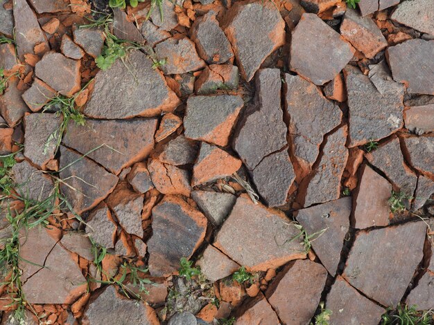 Brick red roof tiles debris background