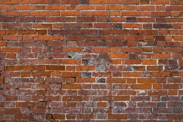 Brick red wall background of a old brick house