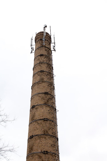 Brick tower. Factory tower of red brick