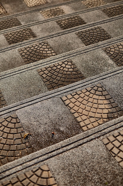 A brick walkway with a pattern of bricks and the word " water " on it.