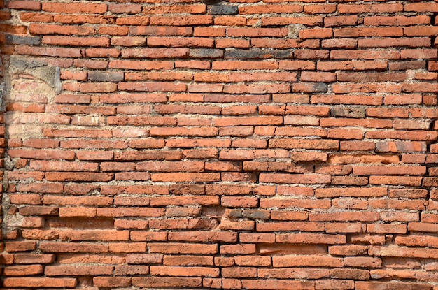 Brick wall Background ruins of Wat Worachet Tharam temple in Ayutthaya Thailand