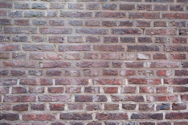 Brick wall background texture Netherlands faded red bricks empty brickwork