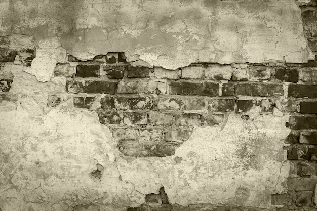 Brick wall close up Old damaged brick wall with cement close upstone brick texture plaster