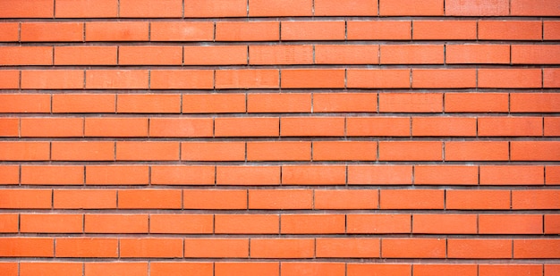 Brick wall of fence as texture or background long picture of new modern brickwork