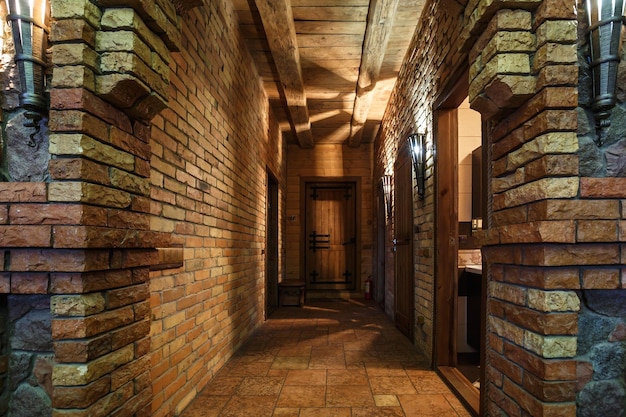 Brick wall in interior entrance corridor of vacation house