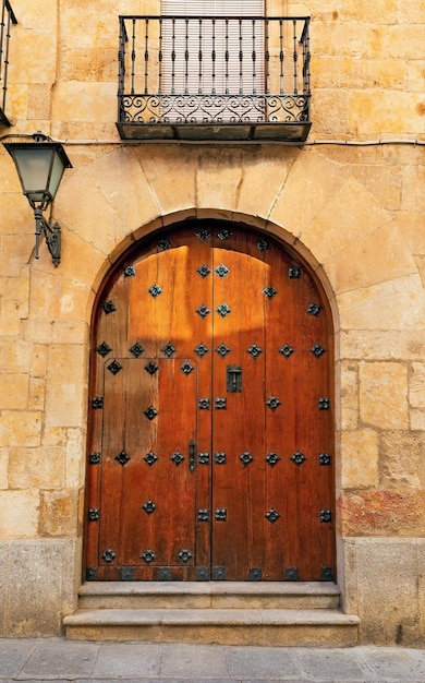 Brick wall and old wooden gate