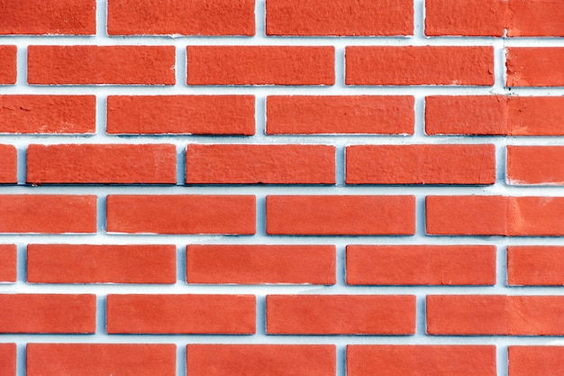 Brick wall of terracotta with pink tint. Bright background.