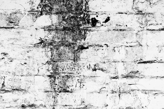 レンガの壁のテクスチャの背景。傷やひび割れのあるレンガの質感