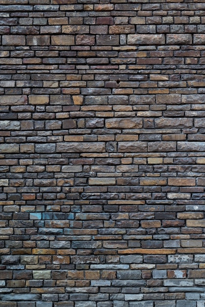 レンガの壁の質感、石積みのモダンな灰色の表面
