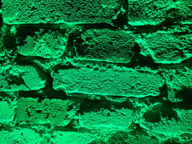 Foto texture di mura di mattoni con retroilluminazione verde sfondi per banner di decorazione di design