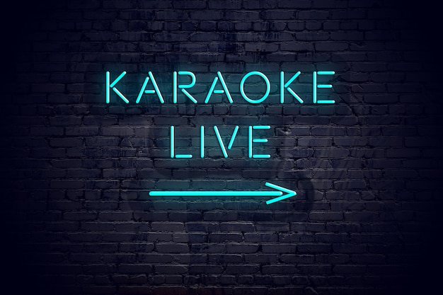 Photo brick wall with neon arrow and sign karaoke live.