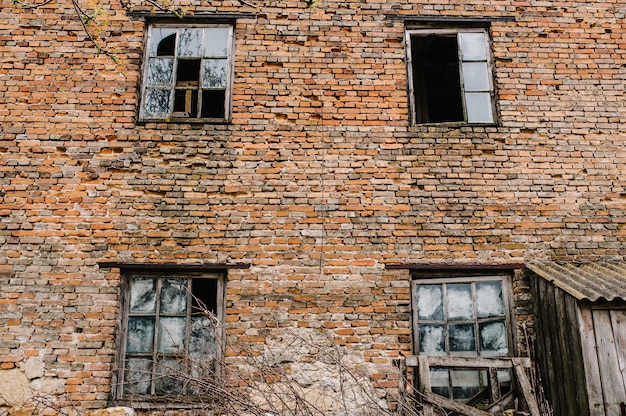 Brick wall with old wooden windows